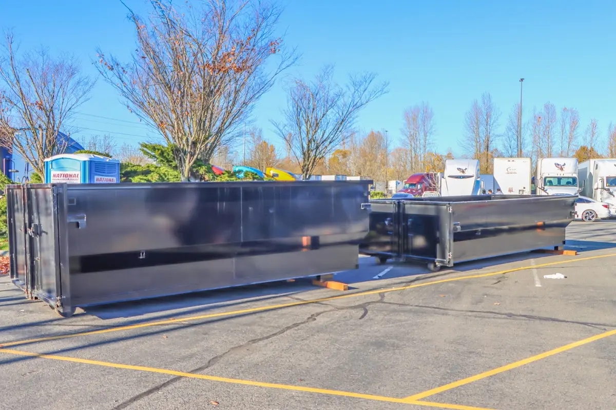 Professional dumpster rental service with roll-off container on residential driveway in Sauk Village